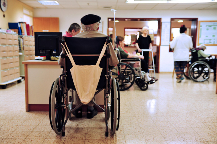 Nursing home scene with a senior in a wheelchair