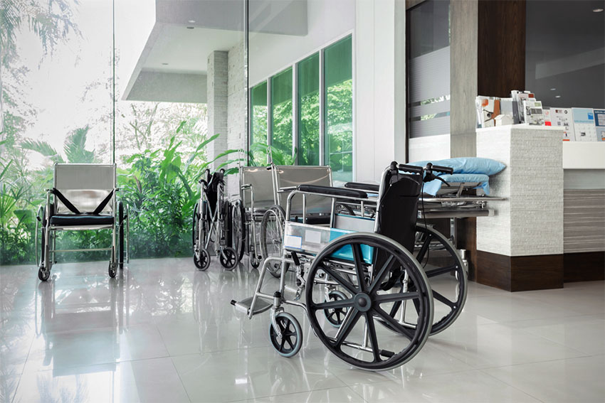 Empty wheelchair in a hospital hallway